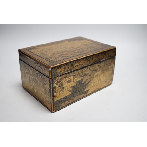 311 - A 19th century Chinese export lacquer tea caddy, black ground with gilt decoration, containing a sep... 