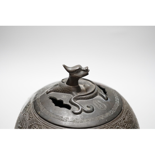 319 - A Chinese three footed cast and chased bronze globular censer and cover, c.1900, 20cm high