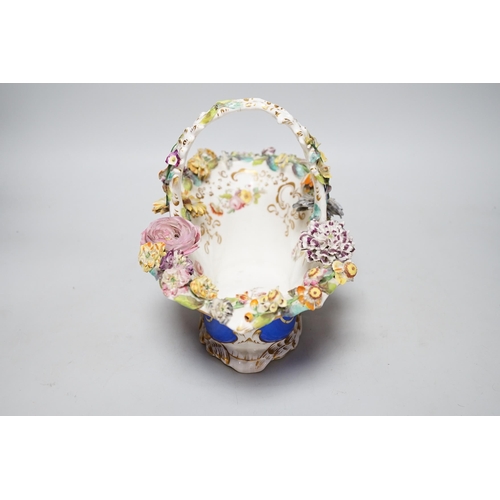 328 - A Rockingham type floral encrusted china basket, 32cm