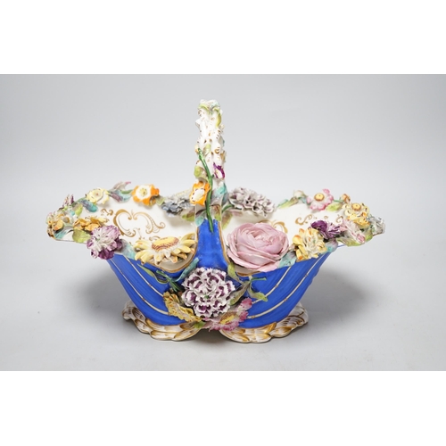 328 - A Rockingham type floral encrusted china basket, 32cm