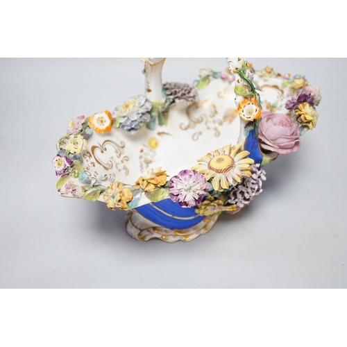 328 - A Rockingham type floral encrusted china basket, 32cm