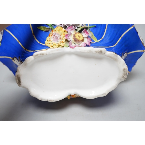 328 - A Rockingham type floral encrusted china basket, 32cm