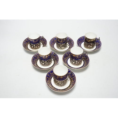 333 - A set of six silver jacketed porcelain cups and saucers