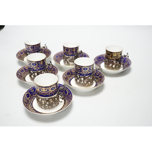 333 - A set of six silver jacketed porcelain cups and saucers