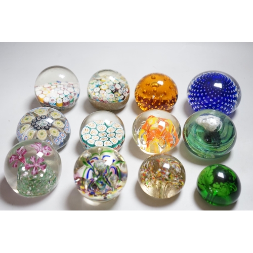 340 - Twelve 20th century paperweights including Bohemian and Chinese examples, close packed millefleur ca... 