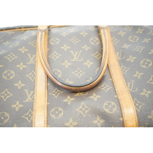 Louis Vuitton, A Louis Vuitton Keepall leather travel bag with luggage tag  width 13cm