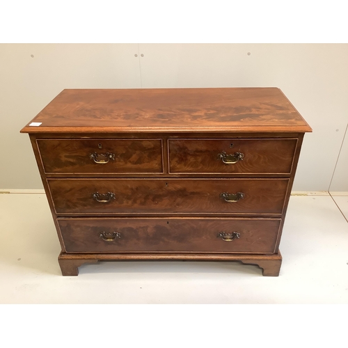 25 - A George III mahogany chest of two short and two long drawers, raised on bracket supports, width 106... 