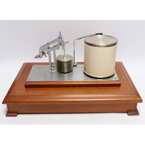 257 - A modern 1980s barograph by Casella in a teak case with bevelled glass panels and incorporating a dr... 