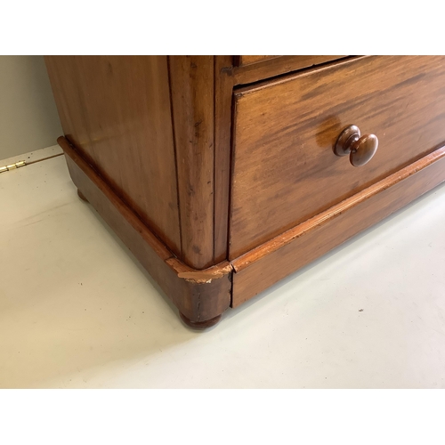 26 - A Victorian mahogany chest of two short and three long drawers, fitted with turned mahogany handles,... 