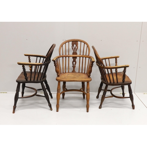 28 - Three 19th century Nottingham area Windsor ash and elm elbow chairs with crinoline stretchers, large... 