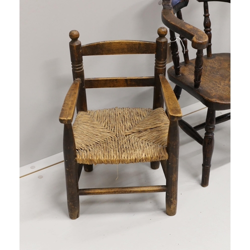 29 - A child's Victorian elm and beech bow chair, a single chair and a rush seat chair