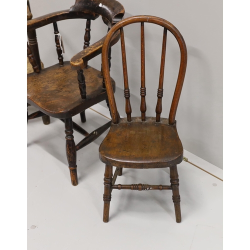 29 - A child's Victorian elm and beech bow chair, a single chair and a rush seat chair