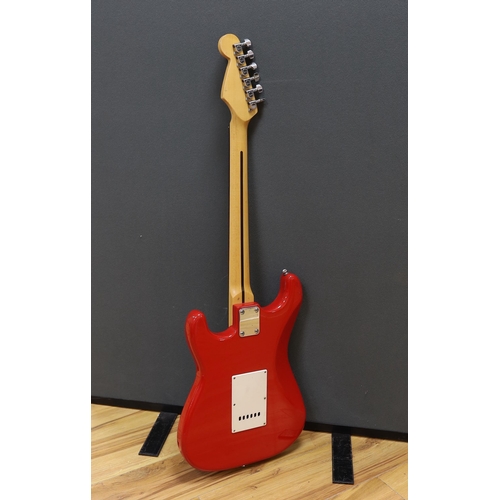 312 - A Squier Strat by Fender electric guitar with rosewood neck and red lacquer body