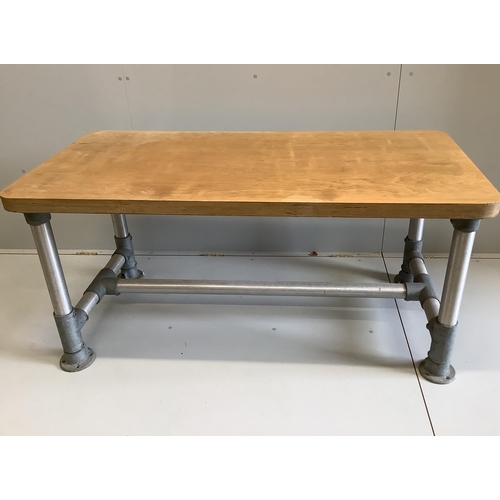 35 - Wolff Olins. An industrial style rectangular table, circa 1970, width 150cm, depth 75cm, height 72cm... 