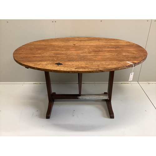 40 - A 19th century French oval pine and fruitwood Vigneron, width 125cm, depth 101cm, height 72cm