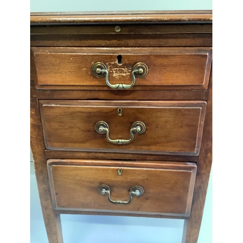 54 - An early 20th century mahogany and beech four drawer kneehole writing desk, width 107cm, depth 60cm,... 