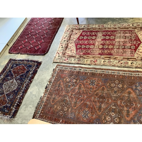 60 - Two antique North West Persian blue ground rugs, a Turkish rug and a Belouch rug, largest 210 x 128c... 