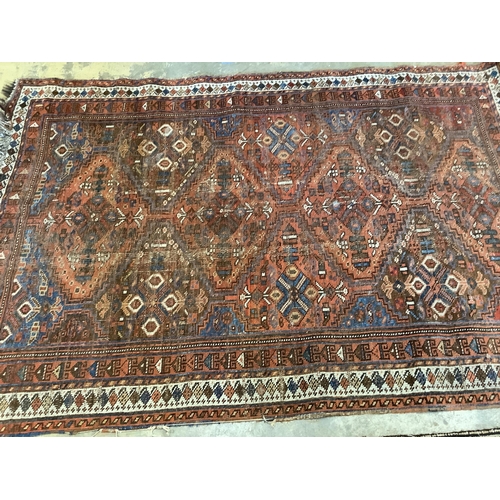 60 - Two antique North West Persian blue ground rugs, a Turkish rug and a Belouch rug, largest 210 x 128c... 