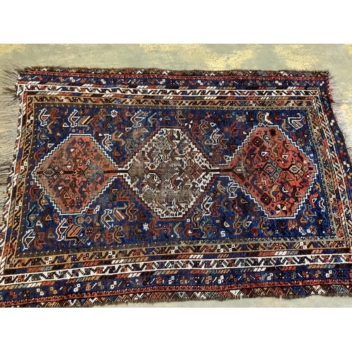 60 - Two antique North West Persian blue ground rugs, a Turkish rug and a Belouch rug, largest 210 x 128c... 