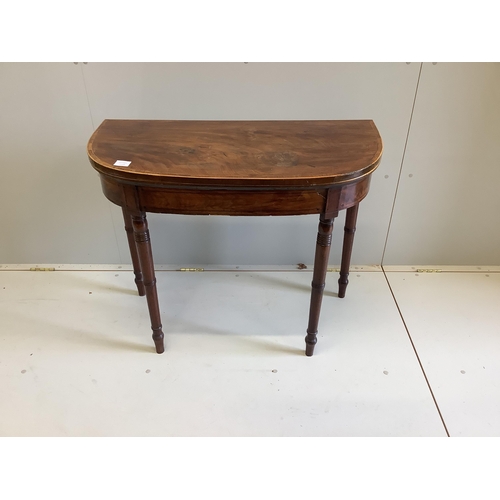 66 - A George III crossbanded mahogany D shaped folding card table, width 91cm, depth 45cm, height 73cm... 