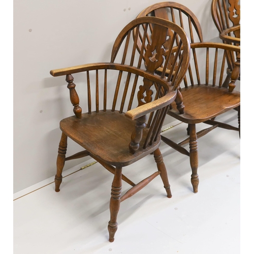 72 - A near set of four 19th century Nottingham area elm, ash and beech Windsor elbow chairs, possibly by... 