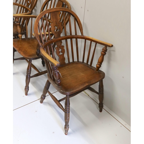 72 - A near set of four 19th century Nottingham area elm, ash and beech Windsor elbow chairs, possibly by... 