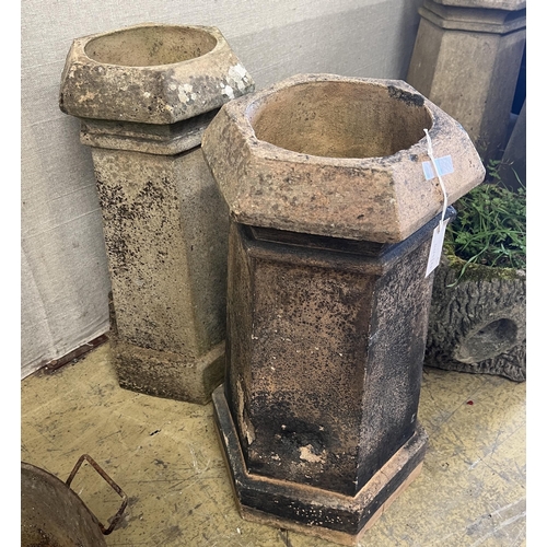 78 - A pair of hexagonal terracotta chimney pots, larger height 71cm