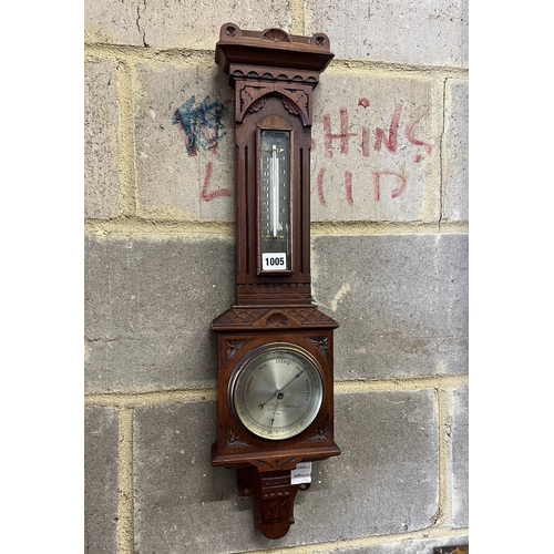 9 - A Victorian walnut cased aesthetic movement style aneroid barometer and thermometer, Negretti & Zamb... 