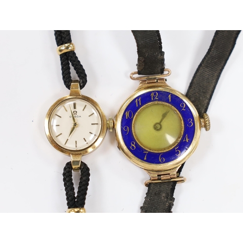 959 - A lady's early 1960's 9ct gold Omega manual wind wrist watch, on a twin strand fabric strap, togethe... 