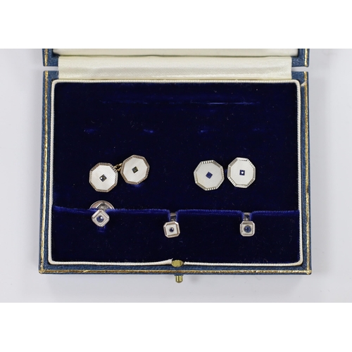 962 - A cased matched 9ct, mother of pearl and blue stone set five piece cufflink and dress stud set.... 