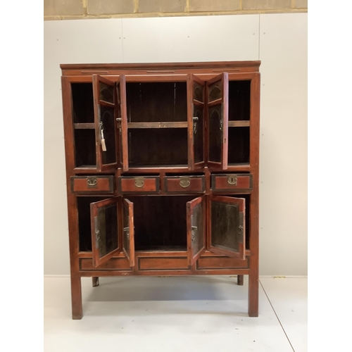 1006 - A Chinese lacquered pine side cabinet, width 134cm, depth 55cm, height 180cm