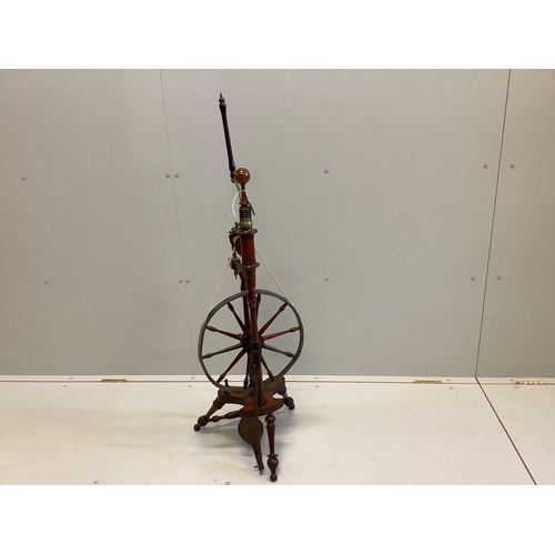 1008 - A 19th century lead and brass mounted turned mahogany spinning wheel, height 118cm