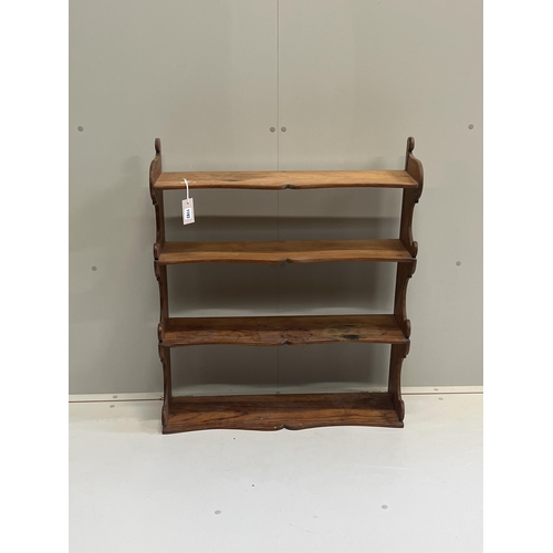 1009 - A Victorian pitch pine four tier wall bracket, width 75cm, depth 21cm, height 87cm