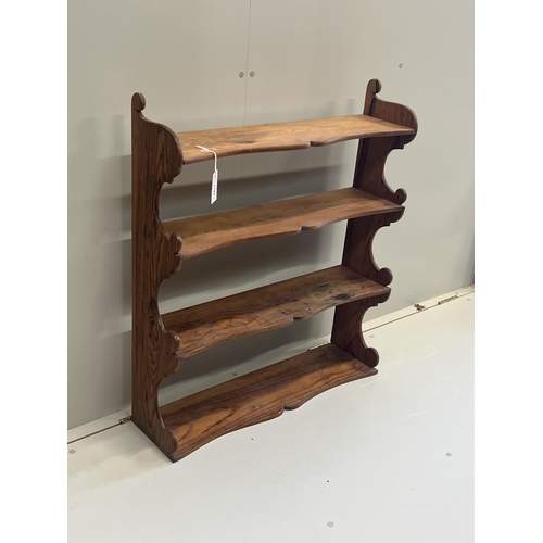 1009 - A Victorian pitch pine four tier wall bracket, width 75cm, depth 21cm, height 87cm