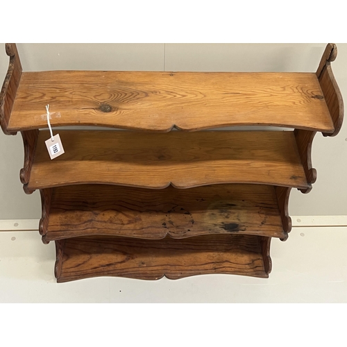 1009 - A Victorian pitch pine four tier wall bracket, width 75cm, depth 21cm, height 87cm