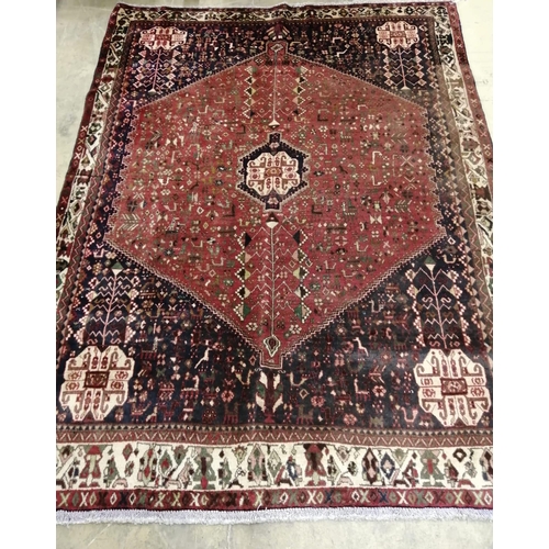 1025 - An Abadeh brick red ground carpet,  210 x 155cm