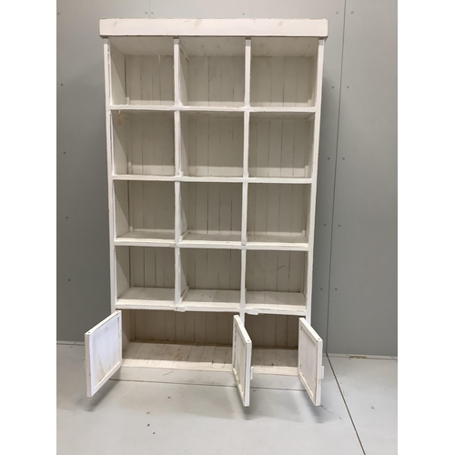 1043 - A painted pine pigeonhole unit, width 119cm, depth 39cm, height 201cm