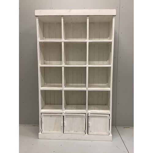 1043 - A painted pine pigeonhole unit, width 119cm, depth 39cm, height 201cm