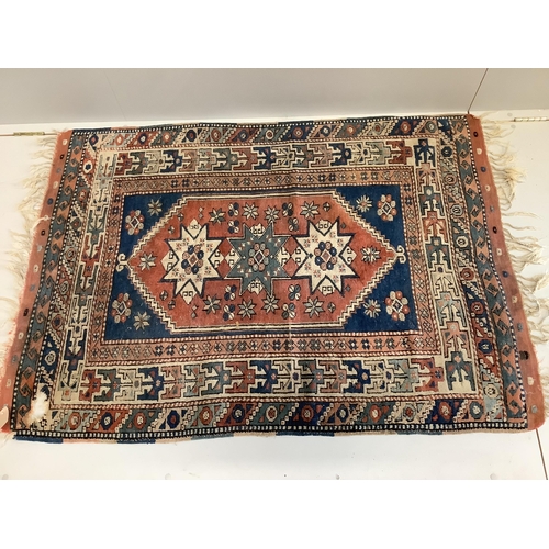 1045 - A Caucasian blue ground rug, 150 x 106cm