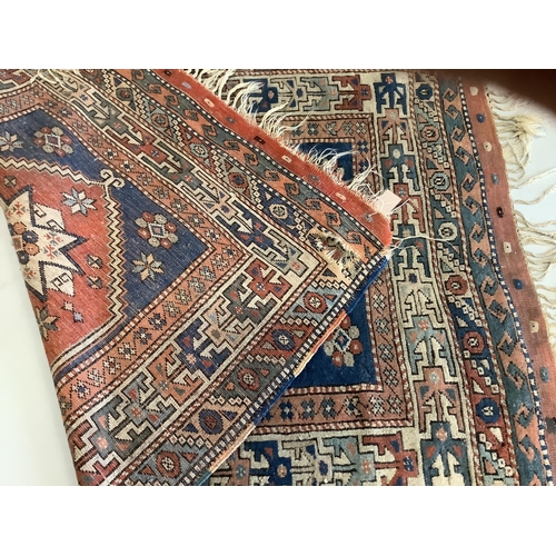 1045 - A Caucasian blue ground rug, 150 x 106cm