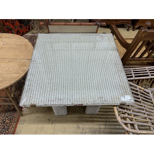 1046 - A vintage Lloyd Loom square table, width 84cm, height 72cm