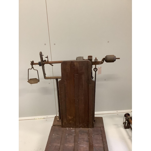 1052 - A set of Victorian oak and cast iron sack scales, height 85cm