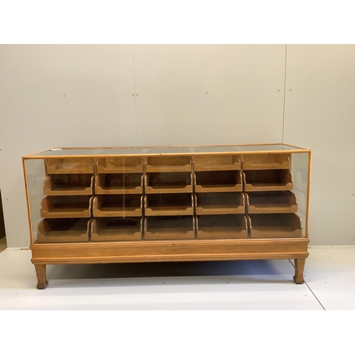 1054 - An early 20th century oak haberdashery cabinet, width 180cm, depth 58cm, height 91cm