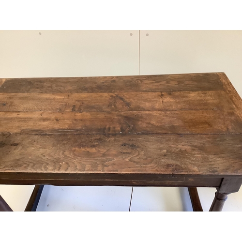 1059 - An 18th century style rectangular oak four plank table, width 128cm, depth 68cm, height 73cm