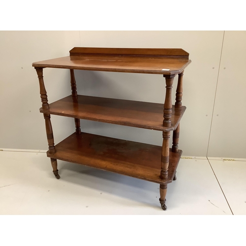 1063 - A late Victorian walnut three tier buffet, width 106cm, depth 51cm, height 107cm