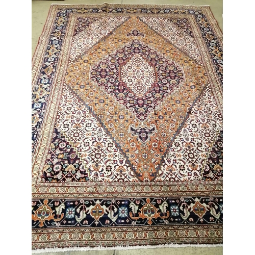 1066 - A Tabriz blue ground carpet, 285 x 205cm