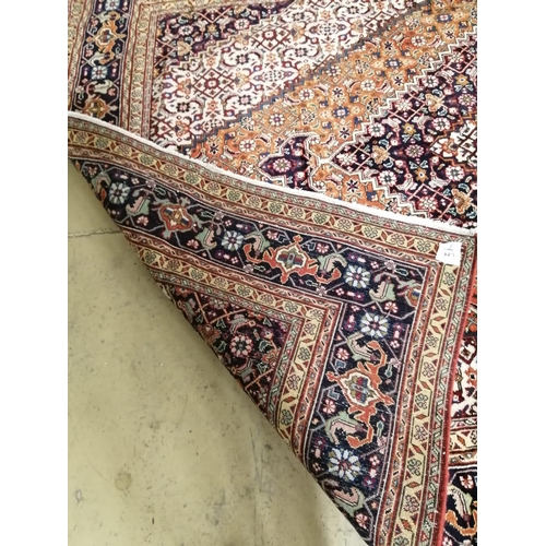 1066 - A Tabriz blue ground carpet, 285 x 205cm