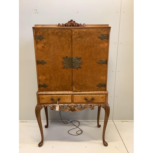 1067 - A mid 20th century Queen Anne revival walnut cocktail cabinet, width 94cm, depth 45cm, height 160cm... 