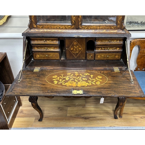 1127 - An early 19th century and later Dutch oak and walnut floral marquetry inlaid bureau bookcase, width ... 