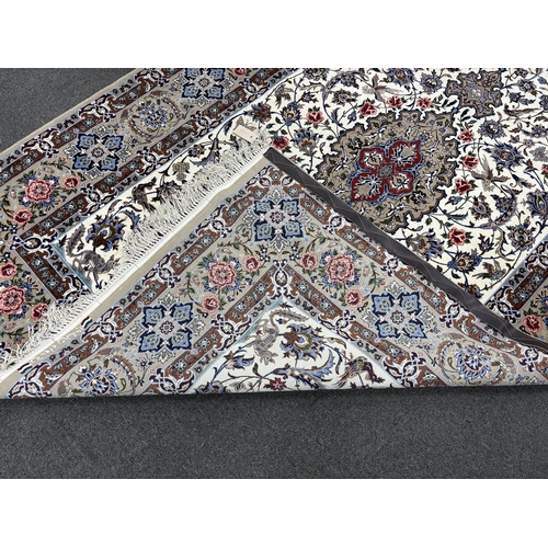 1139 - A Kashan ivory ground floral rug, 220 x 150cm